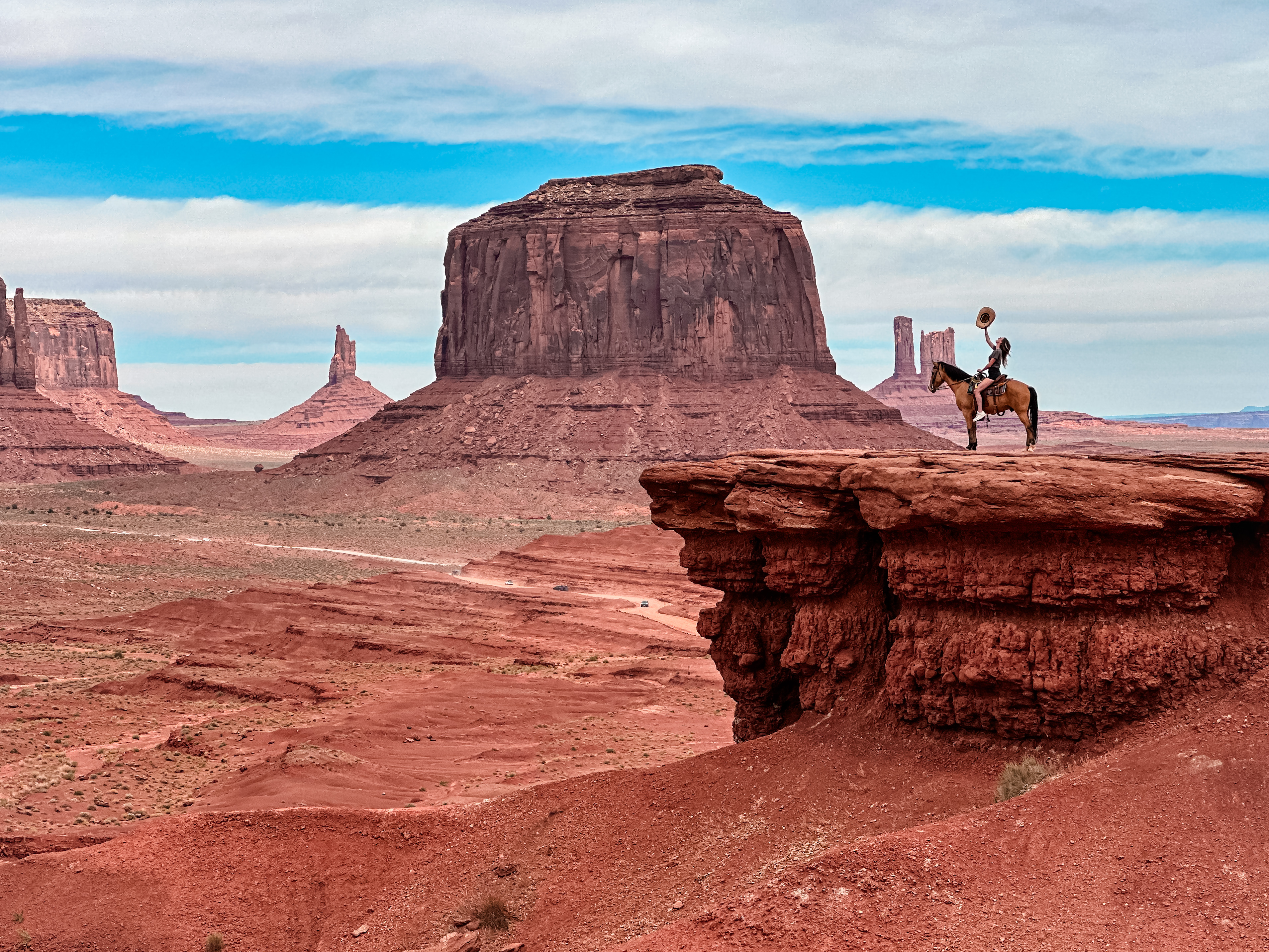 Monument Valley desert landscape with horseback rider in the USA
