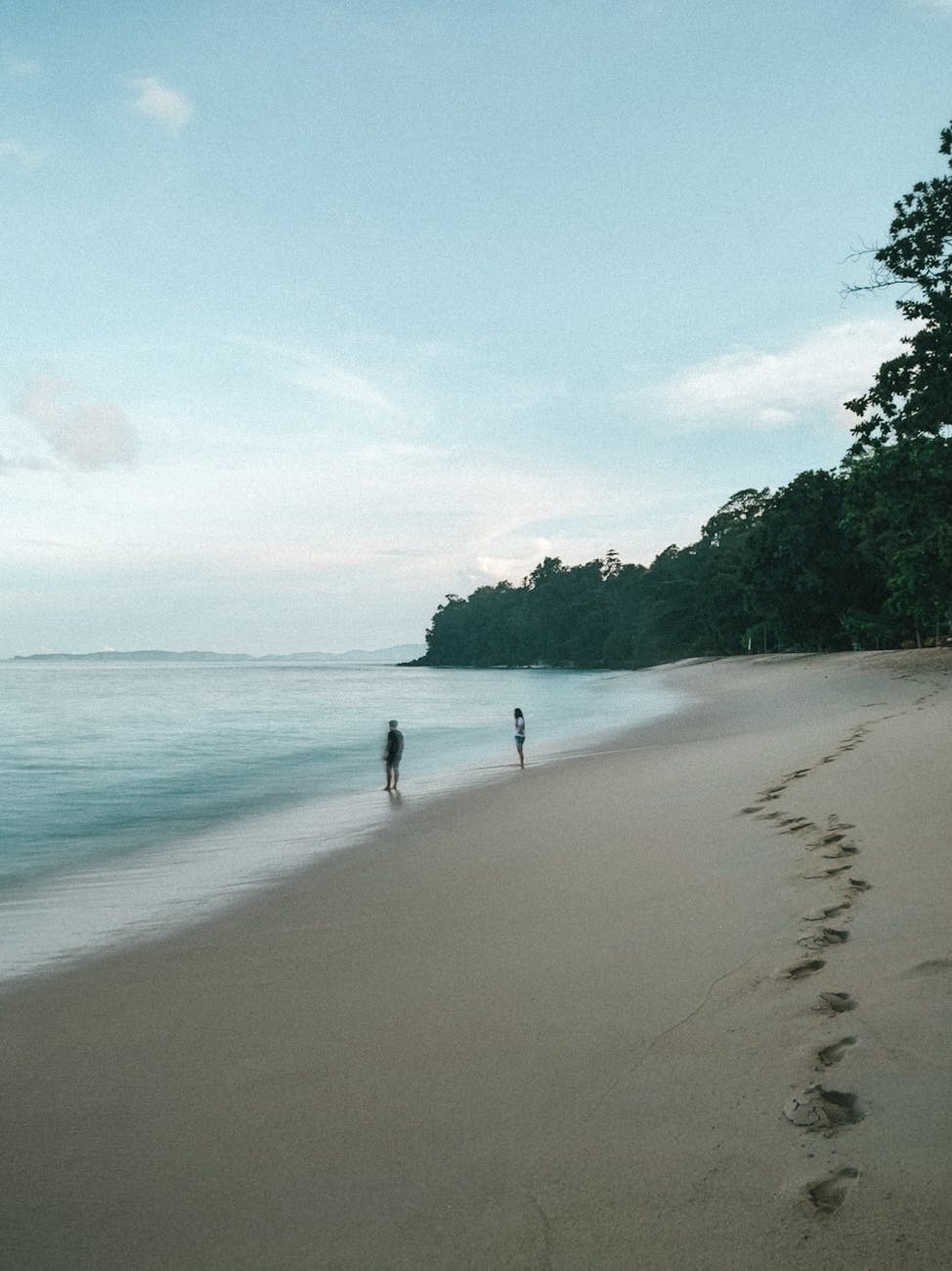 Peaceful Senggigi beach in Lombok with soft sand, calm sea, and a quiet northwest coast view