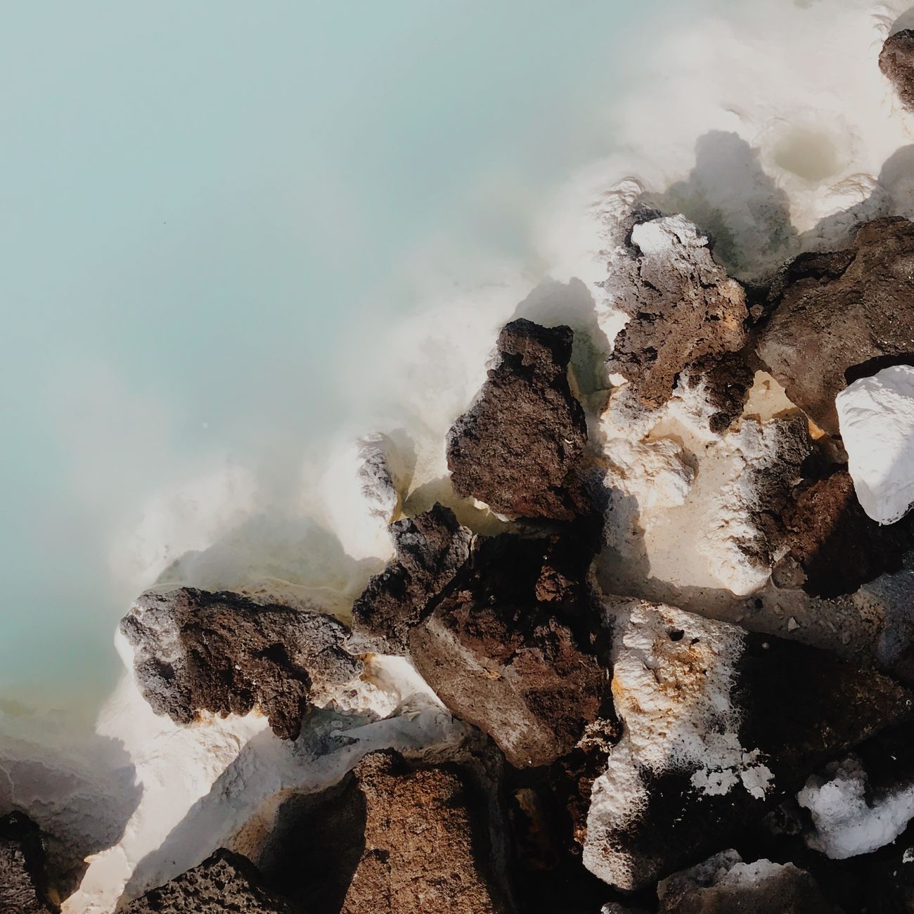 Geothermal rocks and steaming blue water in Iceland