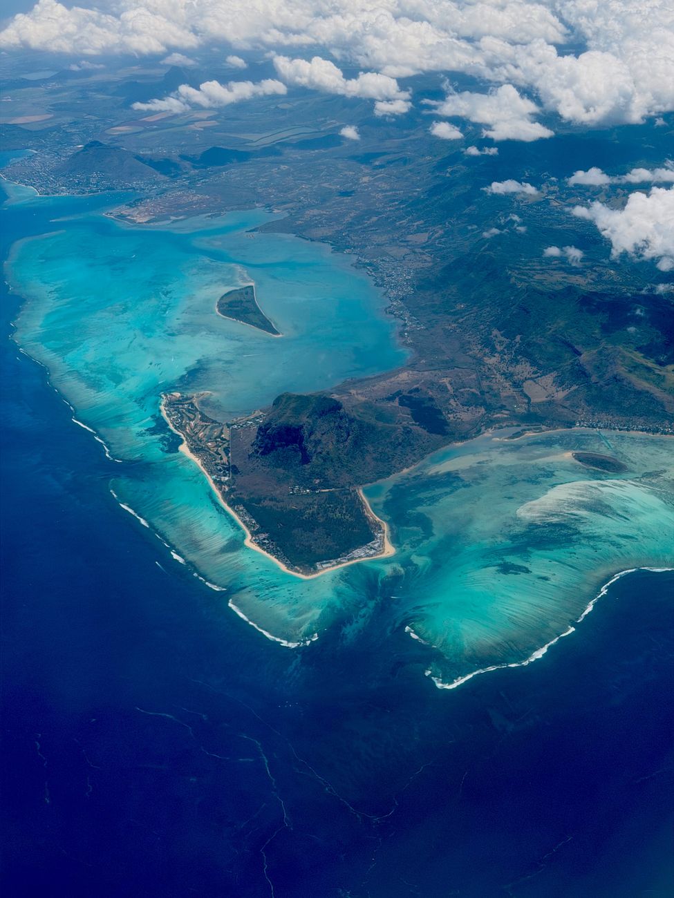 Drone view of the turquoise lagoon and coastline of Mauritius.
