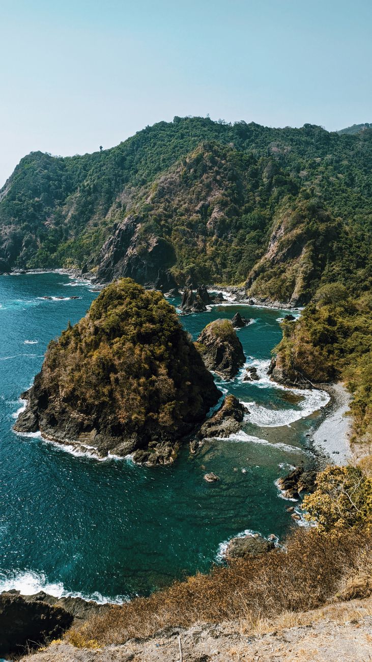 Rocky coastline and blue ocean near Amed in East Bali