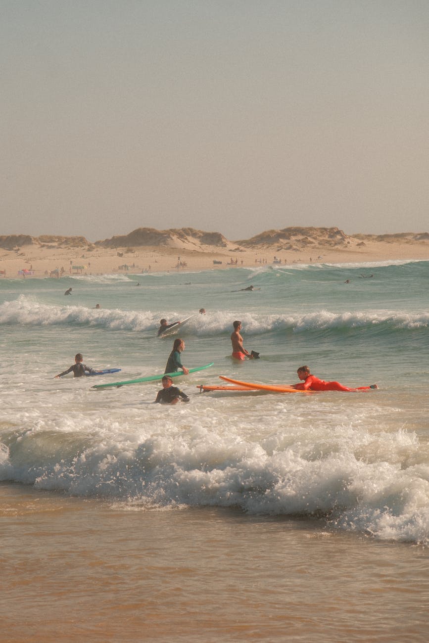 Beginner surfers taking a lesson at Batu Bolong Beach in Canggu