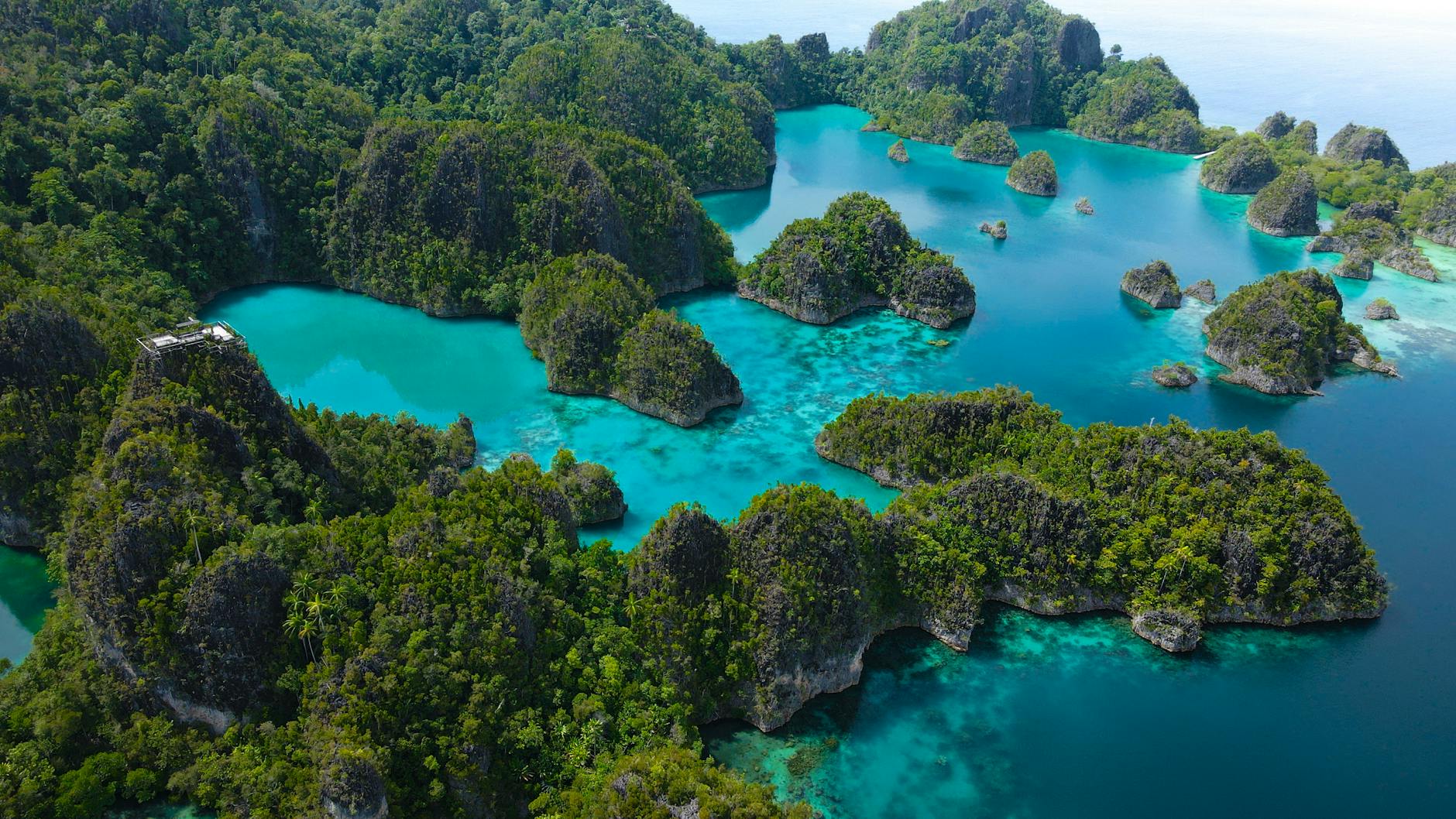 Aerial view of Raja Ampat islands and turquoise water in Indonesia