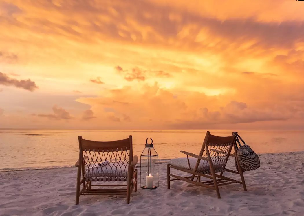 Orange sunset over a remote beach on the south coast of Sumba