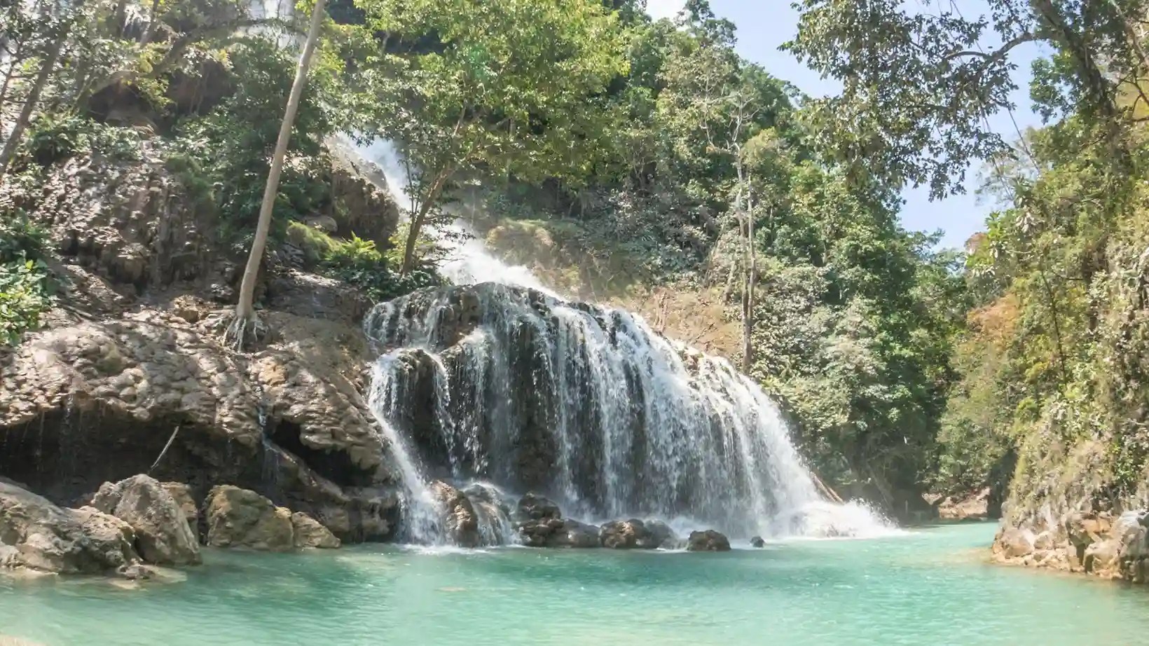 Lapopu Waterfall flowing into a turquoise pool in West Sumba
