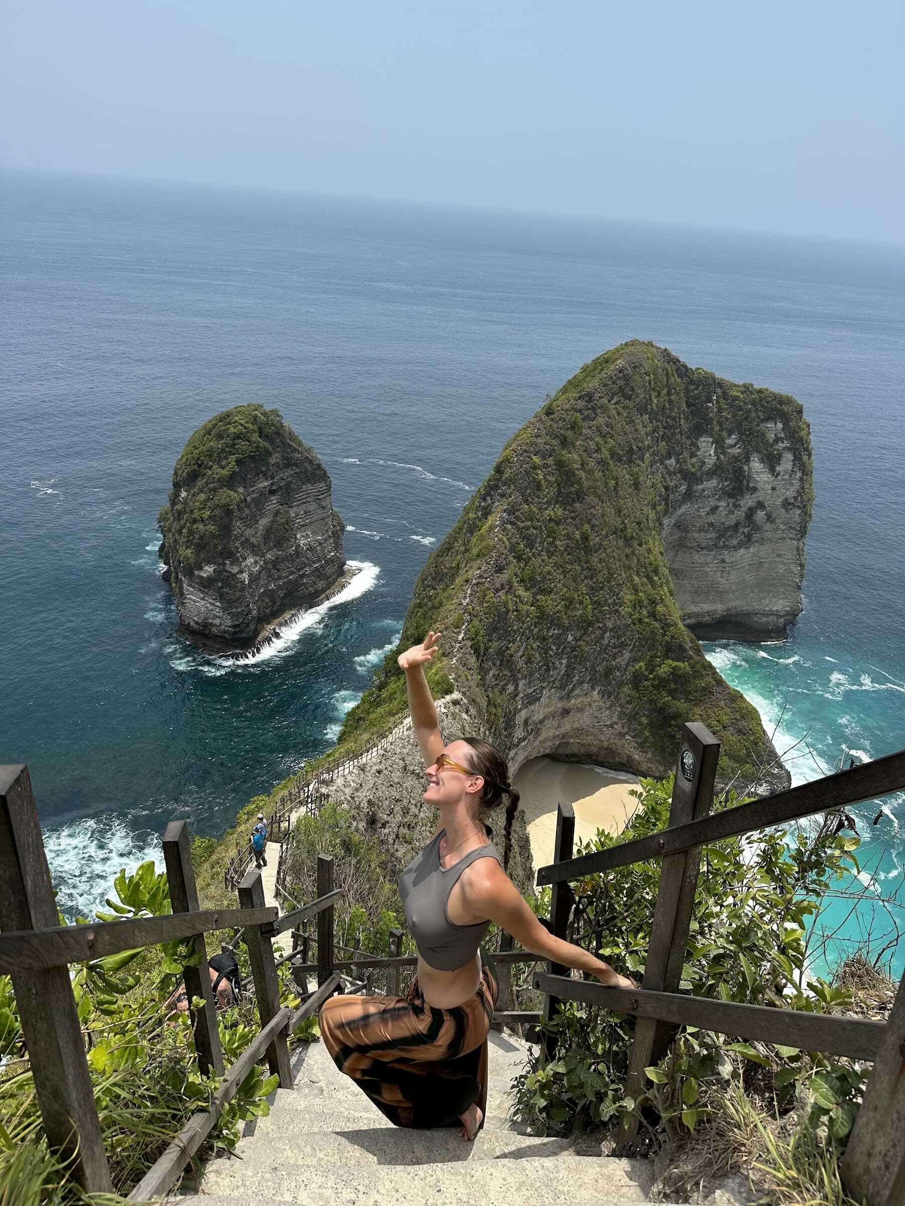 Carlijn at Kelingking Beach viewpoint in Nusa Penida for her Bali travel guide