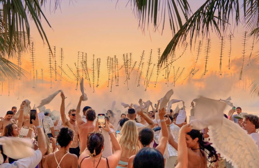 Sunset crowd at a beach club in Uluwatu, Bali