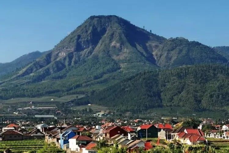 Batu mountain view near Malang with houses in the foreground