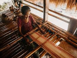 Sumbanese woman weaving traditional ikat fabric by hand
