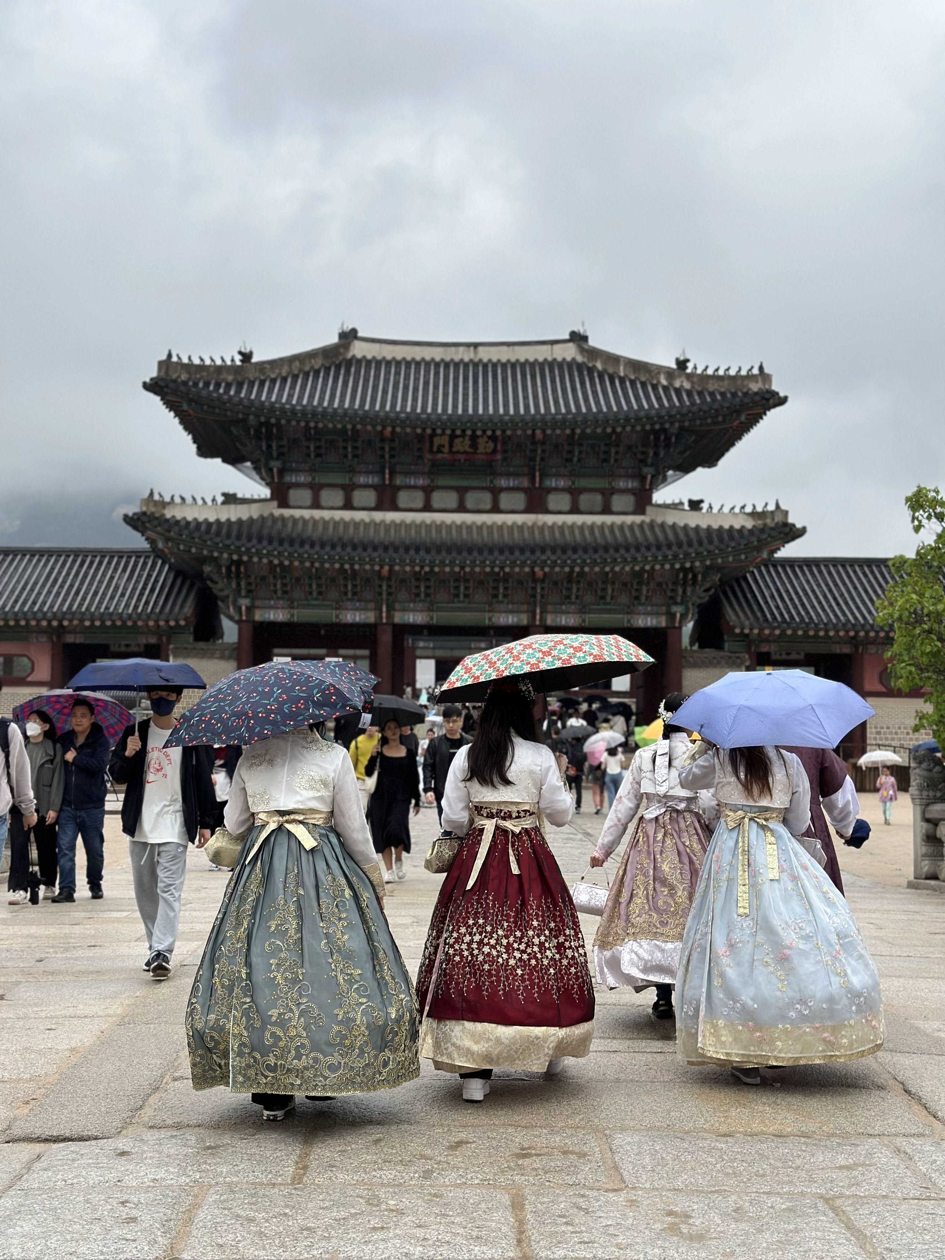 Visitors wearing hanbok at Gyeongbokgung Palace in Seoul