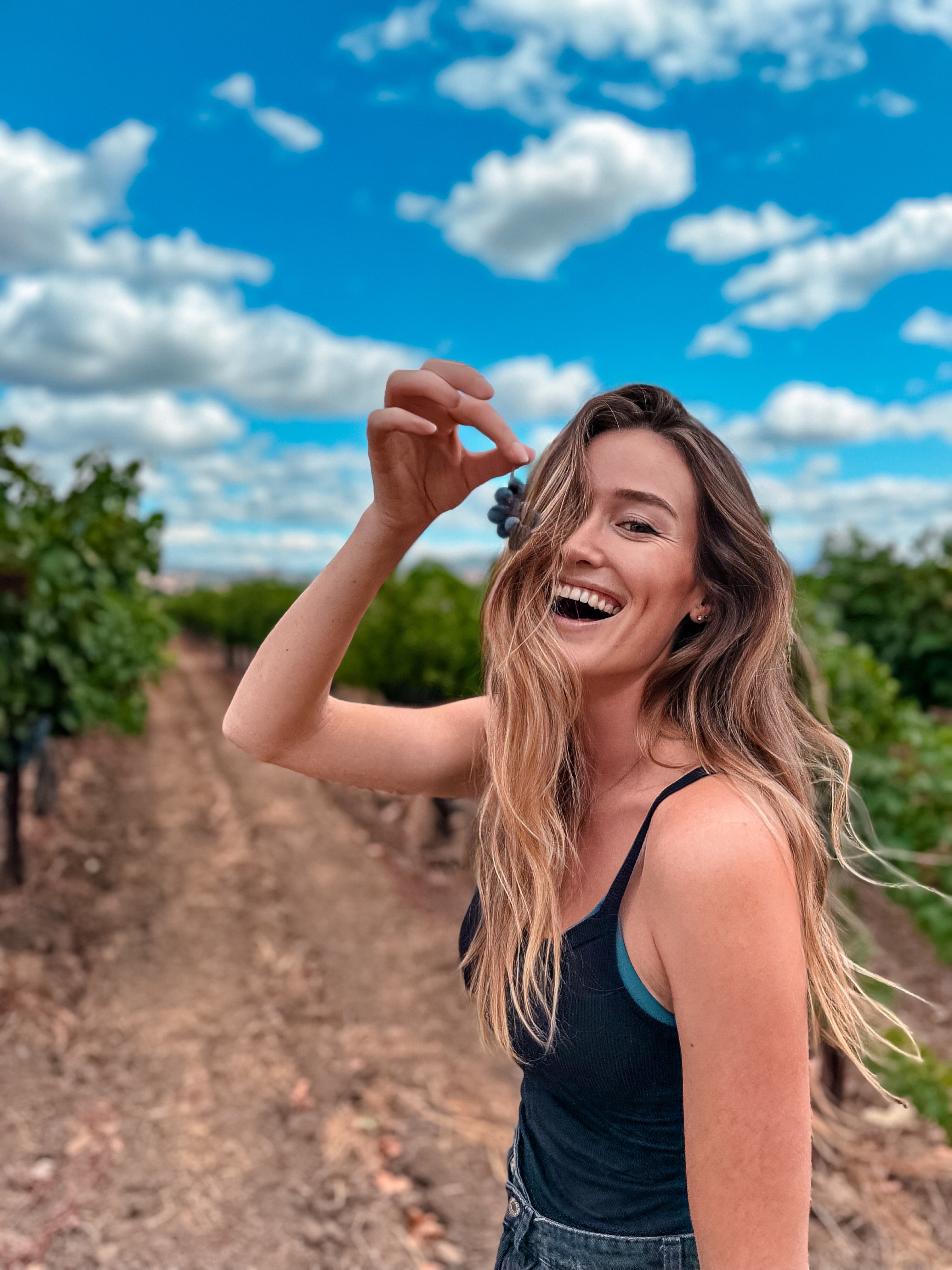 Carlijn laughing on a countryside road trip in the United States