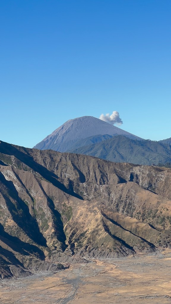 Smoking Mount Bromo volcano seen from the sunrise viewpoint
