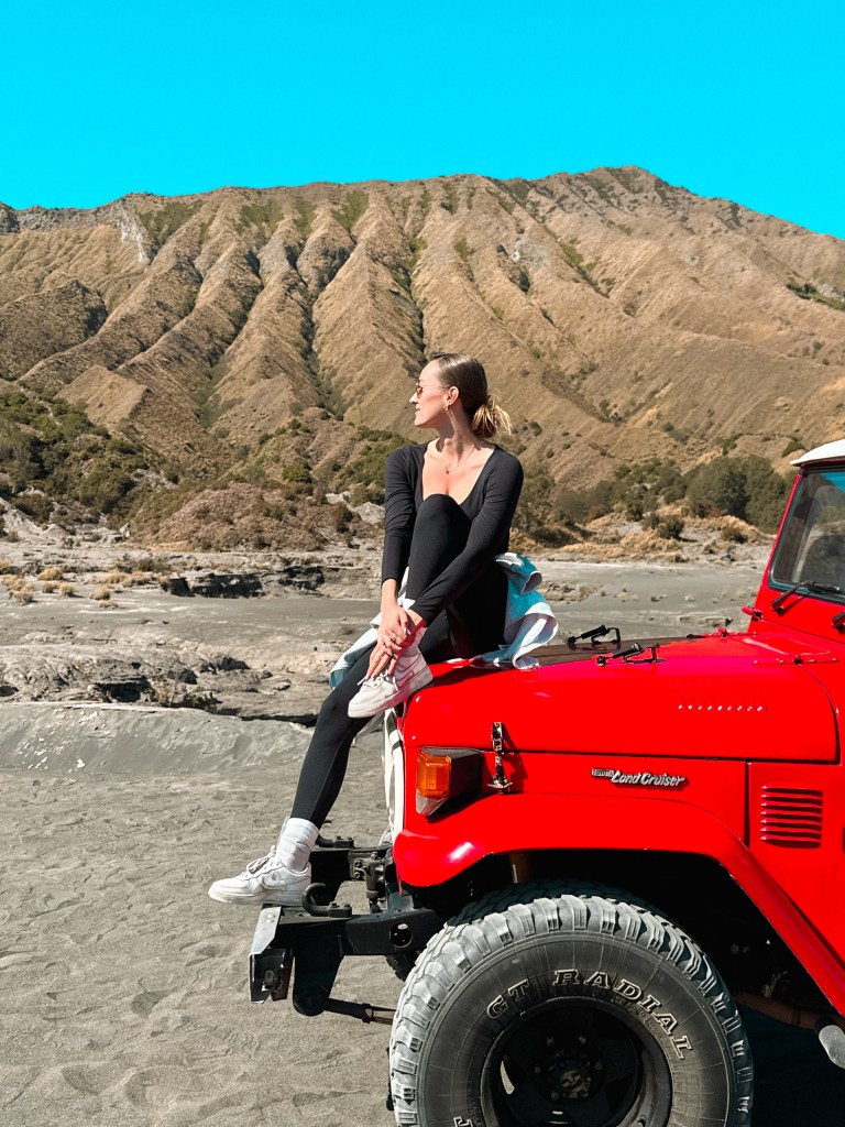 Mount Bromo jeep tour in Java with volcanic sand sea and rugged mountain landscape