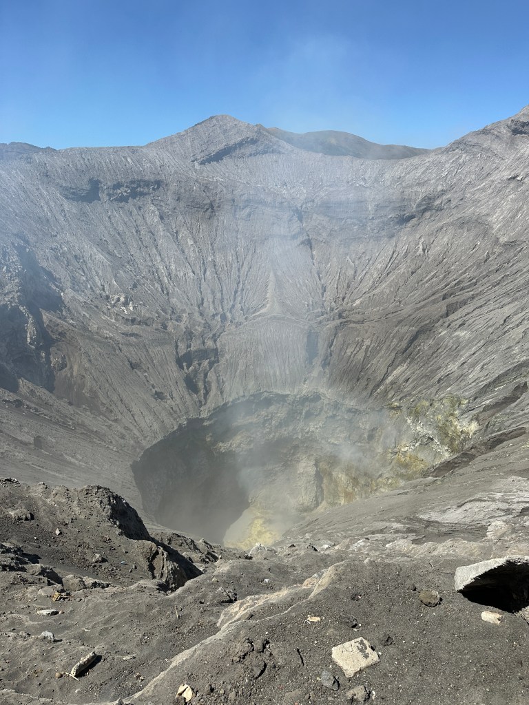 Close view into the smoking crater of Mount Bromo after the sunrise hike