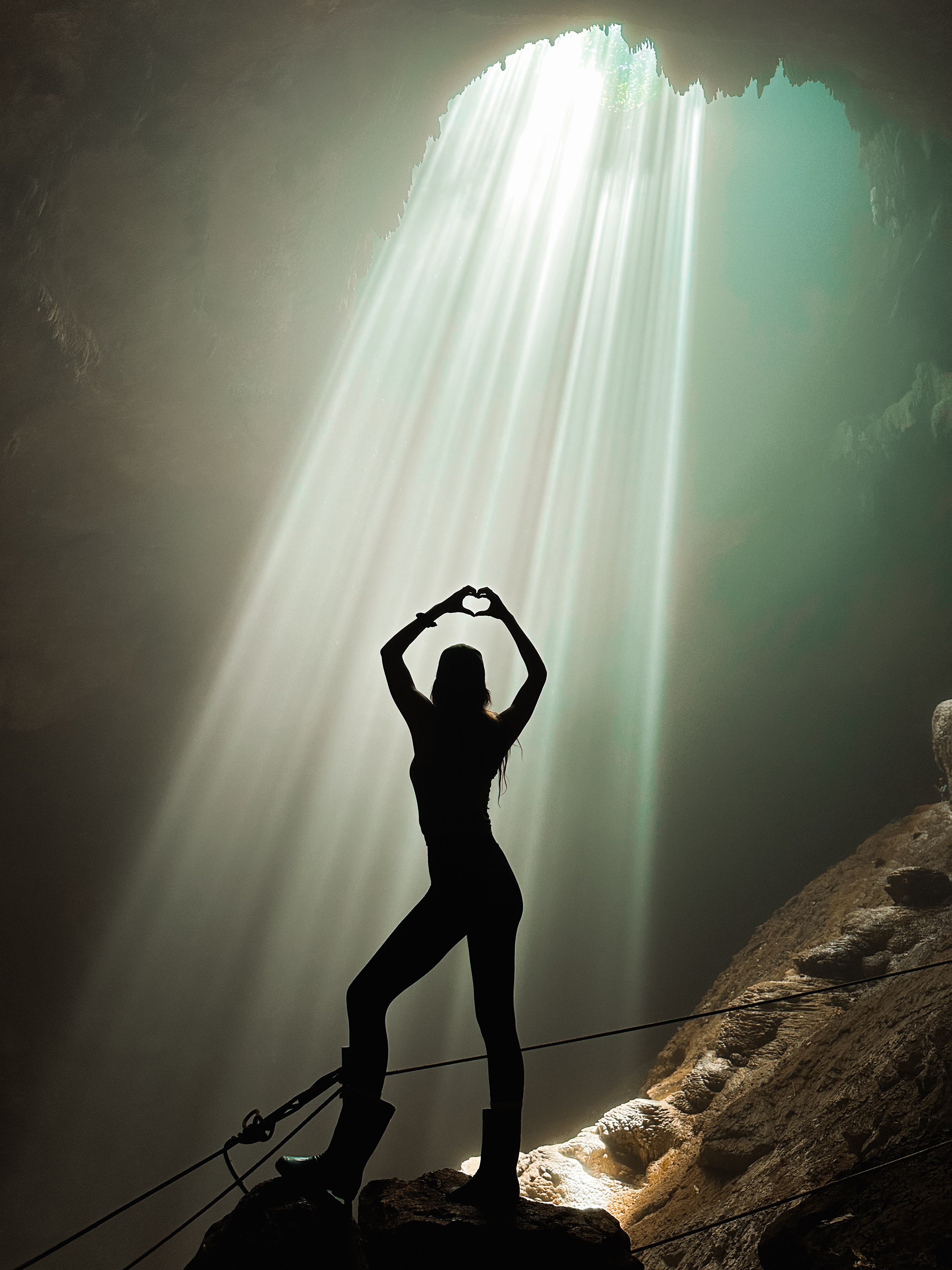 Light beam shining into Jomblang Cave near Yogyakarta