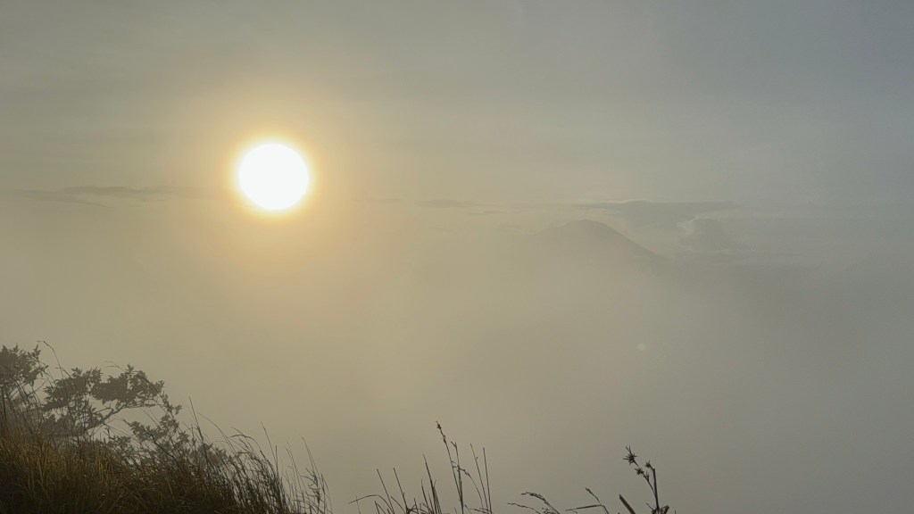 Foggy sunrise view from Mount Batur volcano
