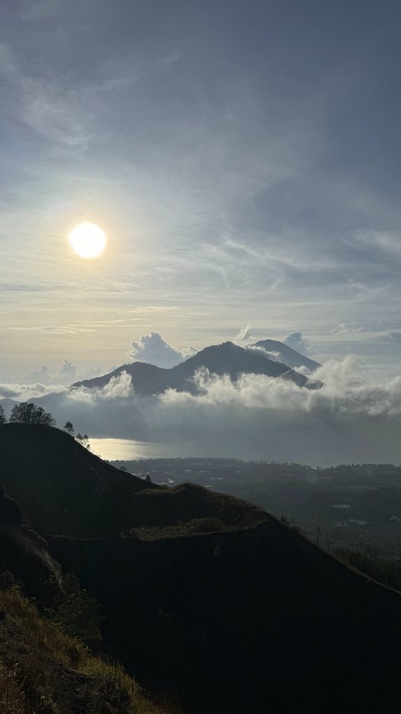 Sunrise above the clouds from Mount Batur in Bali Indonesia
