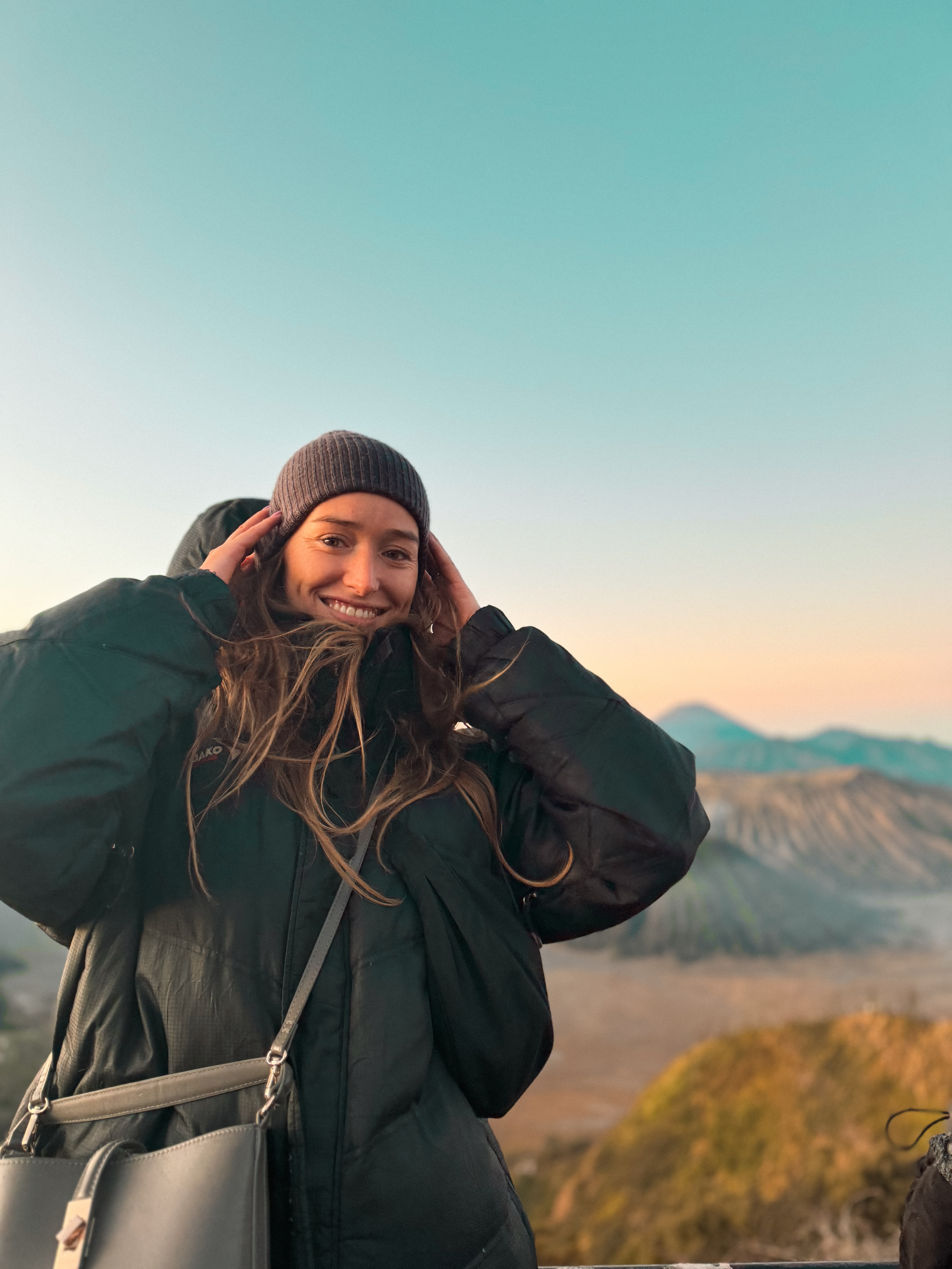 Carlijn smiling at Mount Bromo sunrise with volcanic crater views in East Java, Indonesia
