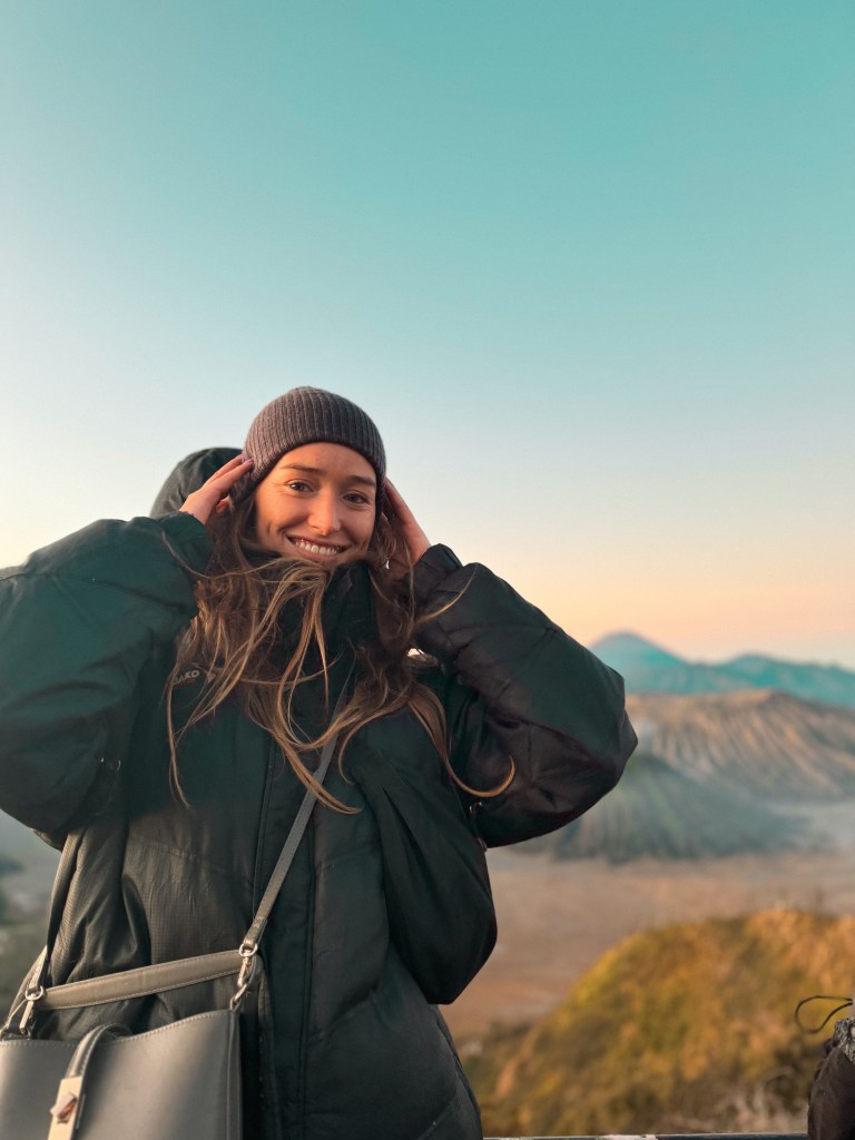 Carlijn smiling at Mount Bromo sunrise with volcanic crater views in East Java, Indonesia