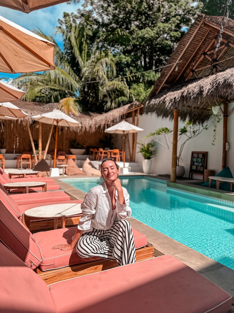 Boutique hotel pool in Kuta, Lombok with tropical sun loungers