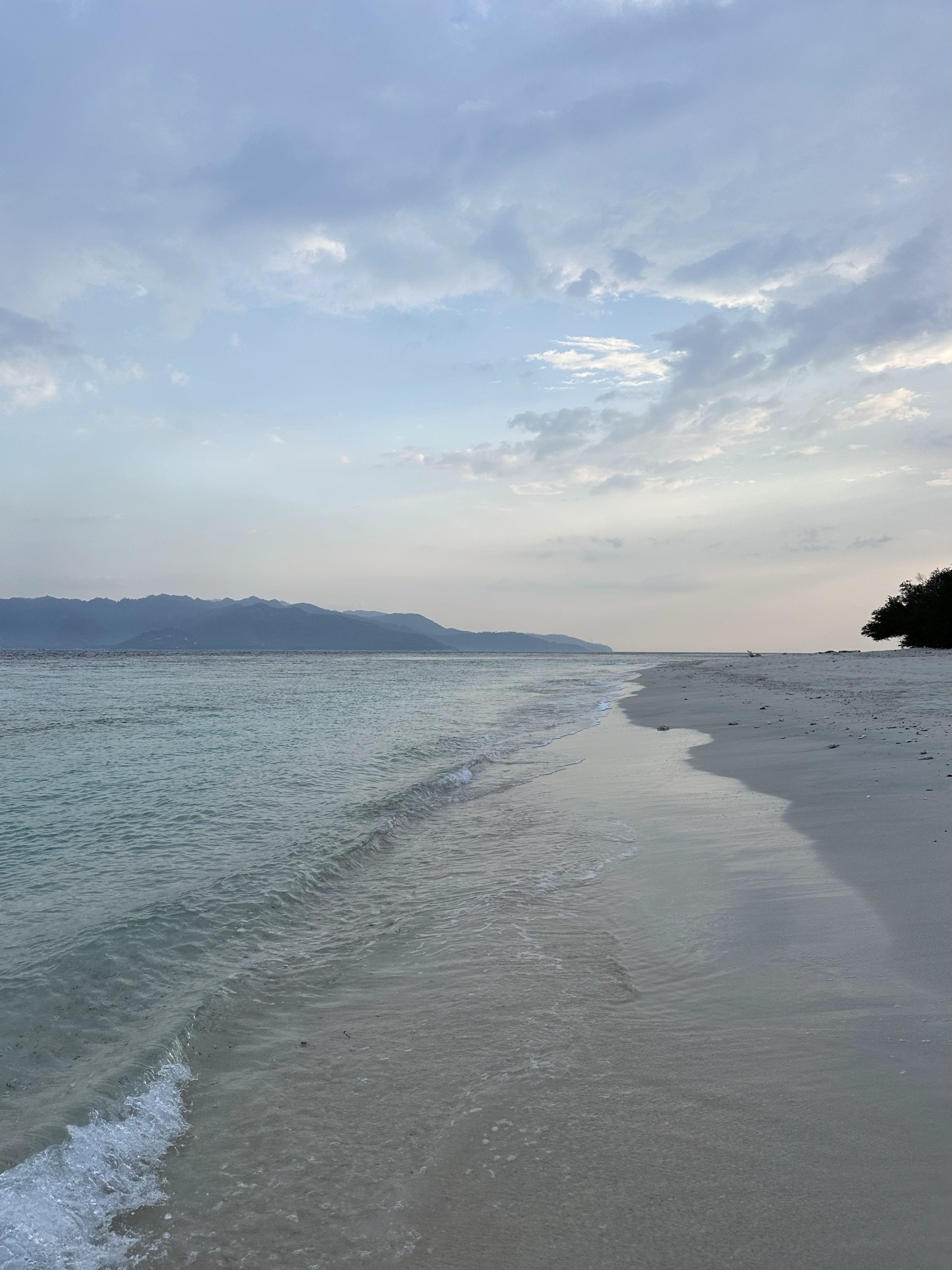 Peaceful beach on Gili Meno with calm water, soft sand, and a quiet island atmosphere