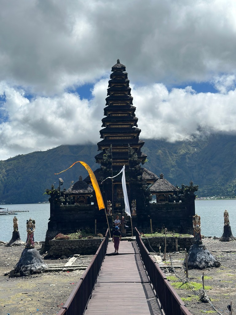 Pura Ulun Danu Batur temple with Lake Batur and mountains in the background