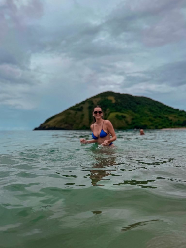 Carlijn swimming in clear water during an Indonesia island hopping trip