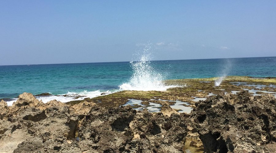 Waves crashing over rocks at Pero Beach in West Sumba