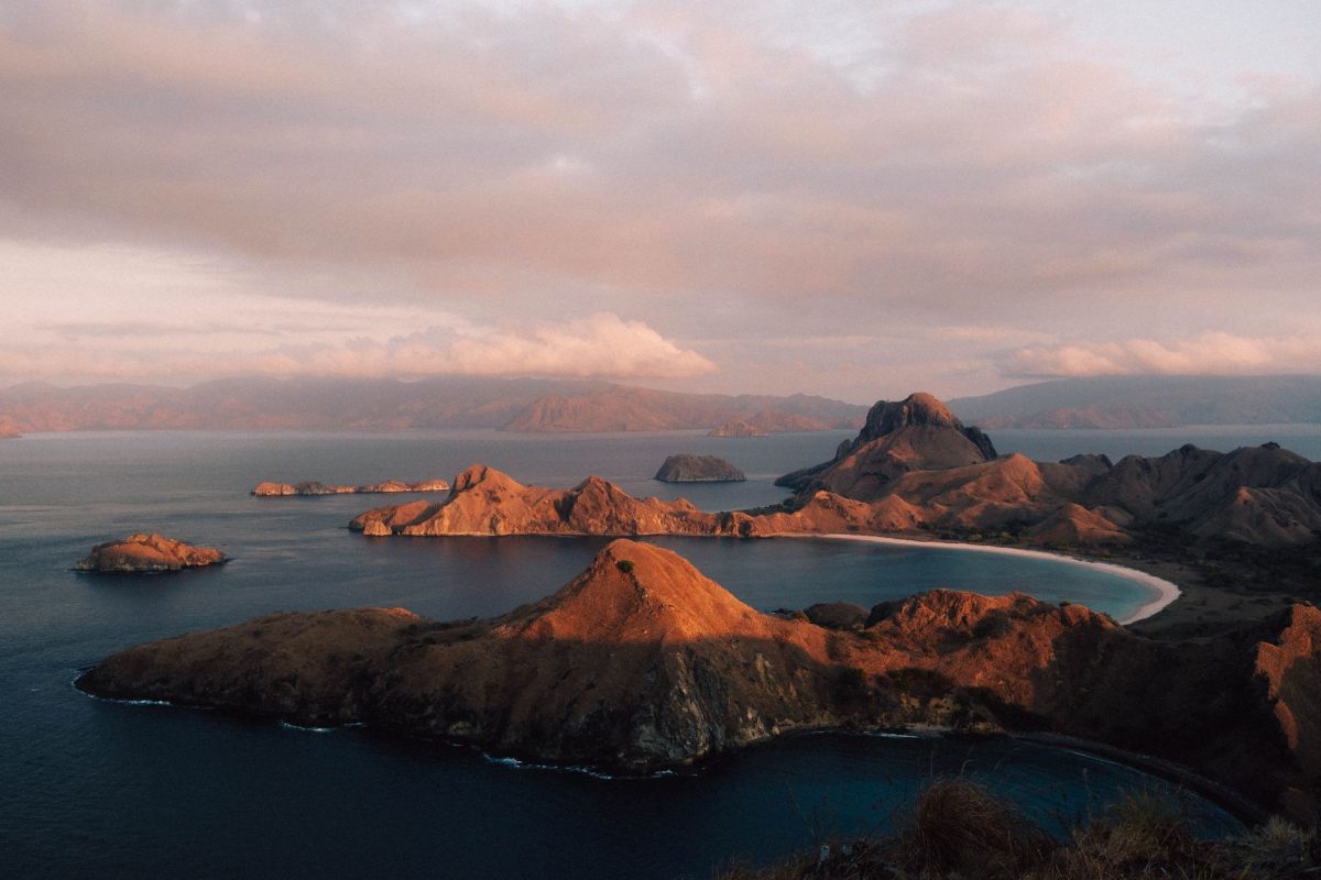 Sunset over the rugged islands and bays of Padar Island in Komodo National Park