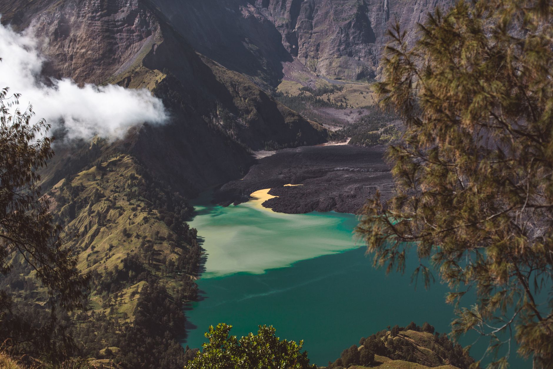View over Mount Rinjani crater lake and steep volcanic cliffs during the Lombok trekking route