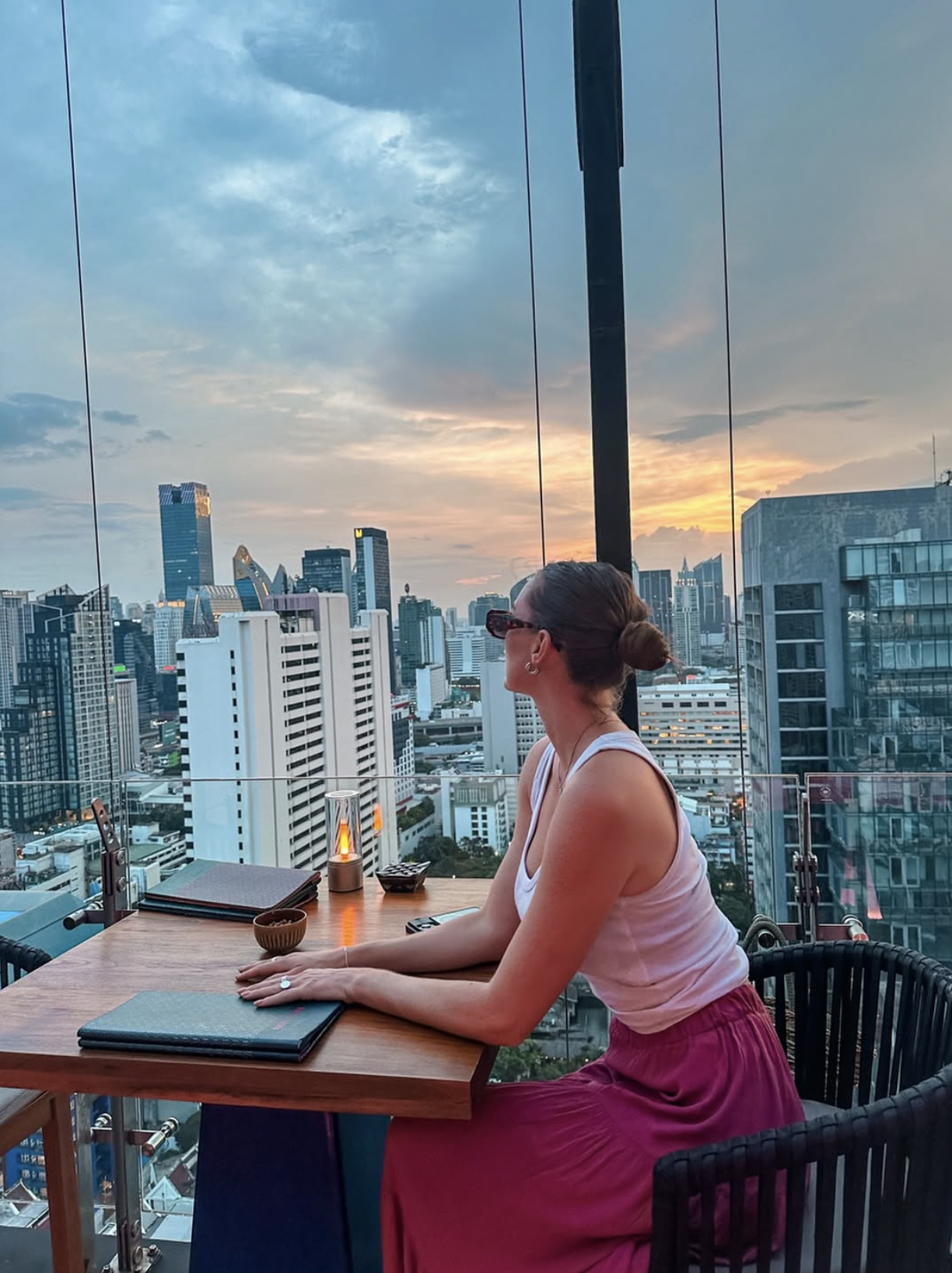 Carlijn at a rooftop bar overlooking Bangkok city skyline