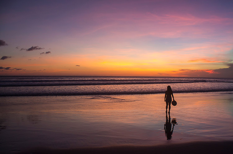 Colorful sunset over Seminyak Beach in Bali