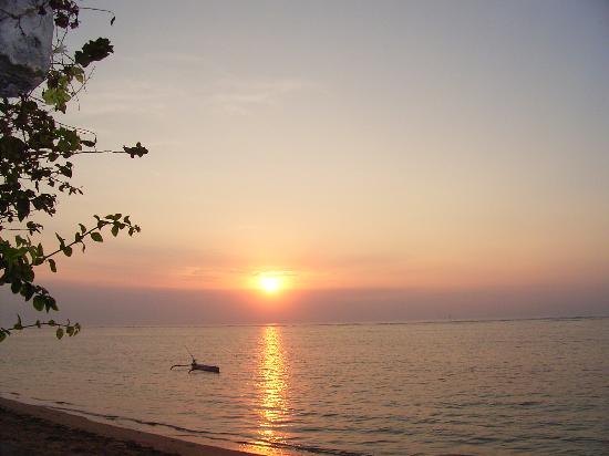Sunrise over the calm sea at Sanur Beach in Bali