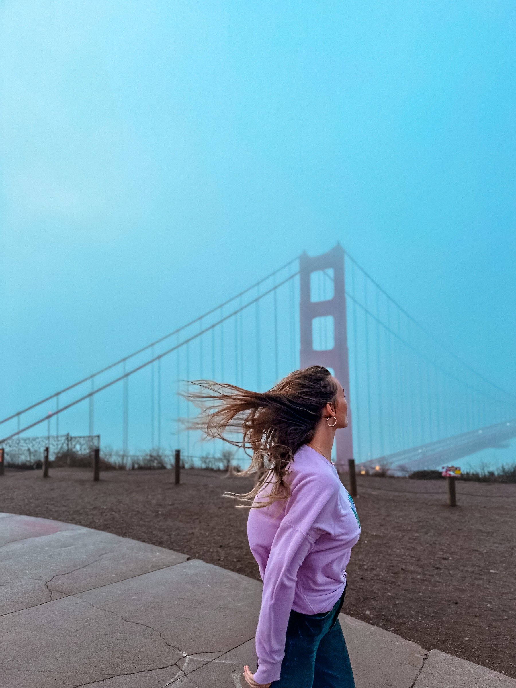 Travel creator overlooking the Golden Gate Bridge in San Francisco, California