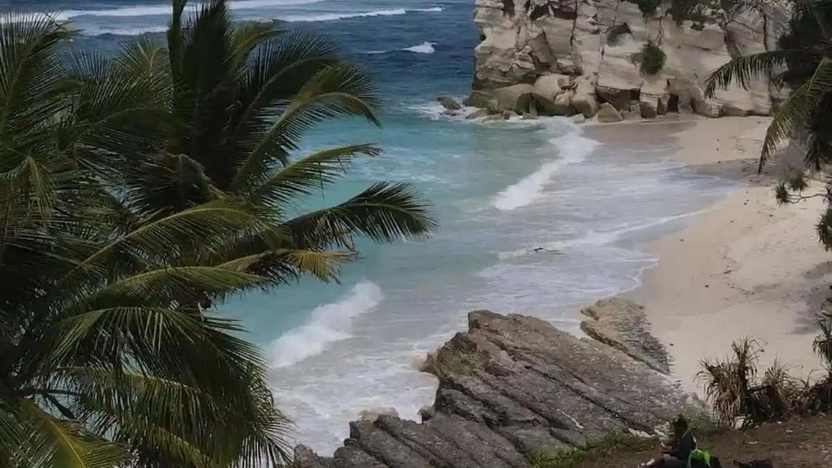 Rocky coastline and waves at Watubela Beach in South Sumba