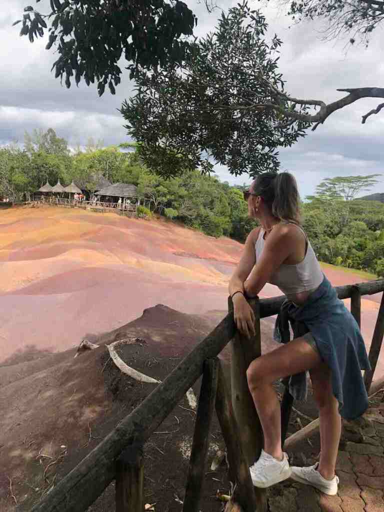 Woman overlooking the Seven Coloured Earth viewpoint in Chamarel, Mauritius.
