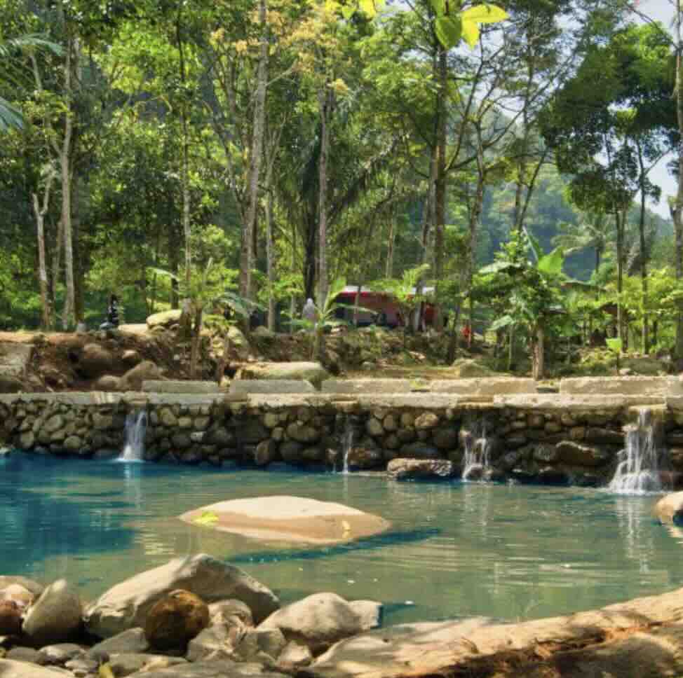 Natural hot spring pools surrounded by tropical greenery at Banjar Hot Springs near Lovina