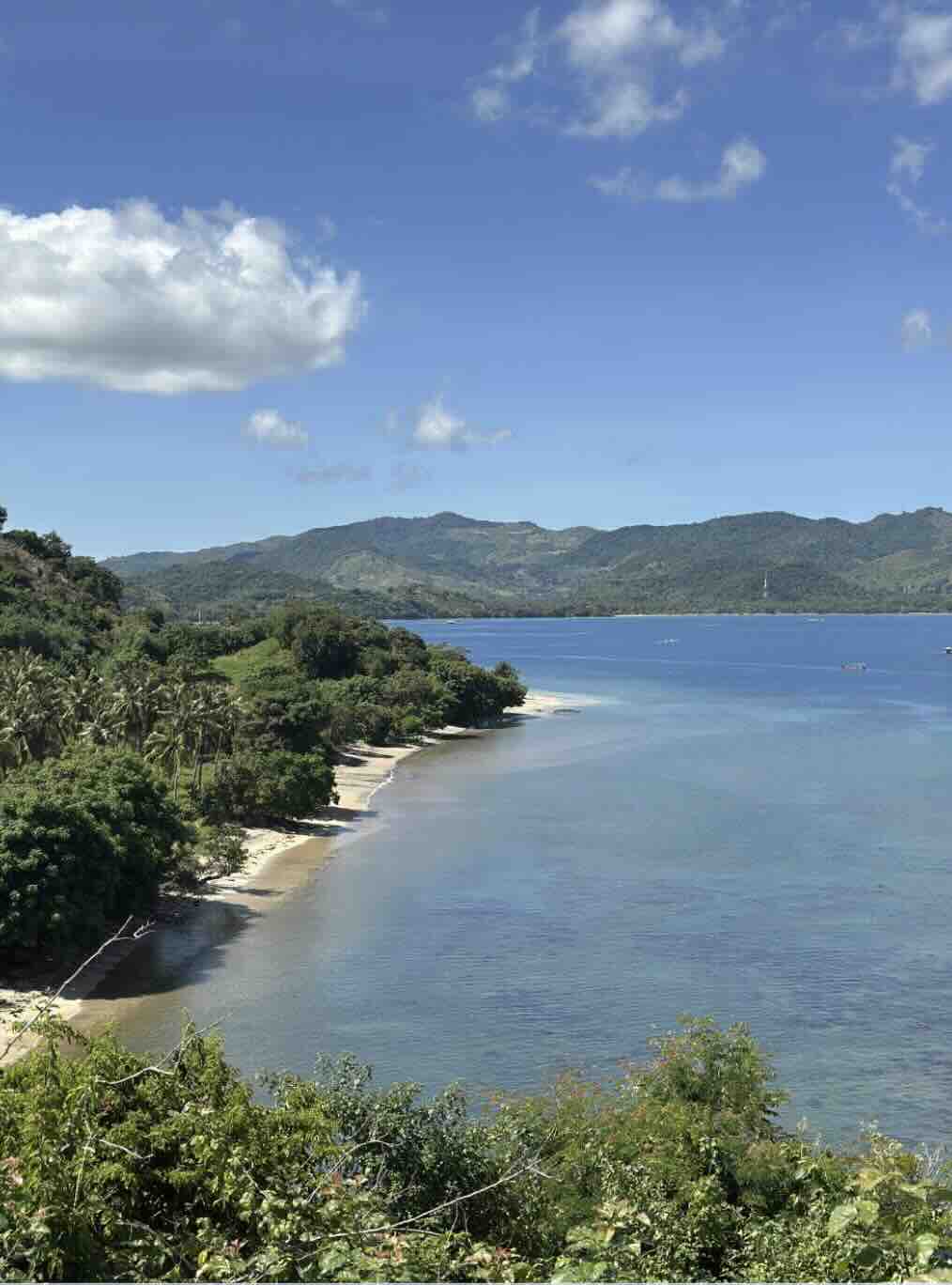 Scenic coastline and calm blue water around Gili Asahan in southwest Lombok