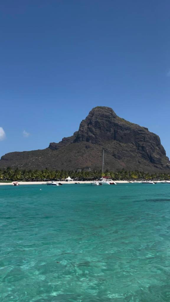 Le Morne Brabant rising above the turquoise lagoon on the southwest coast of Mauritius.