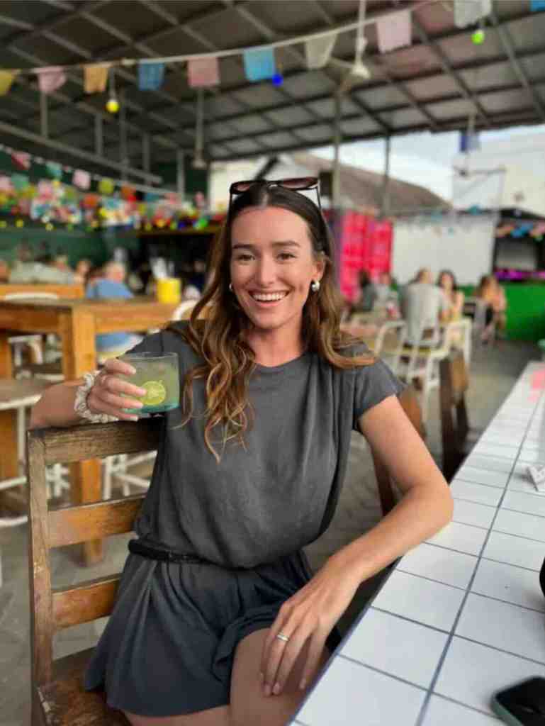 Traveler enjoying a drink at a casual local restaurant in Lombok, Indonesia