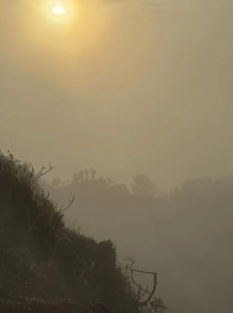 Hazy golden sunrise from the Mount Batur hiking trail in Bali