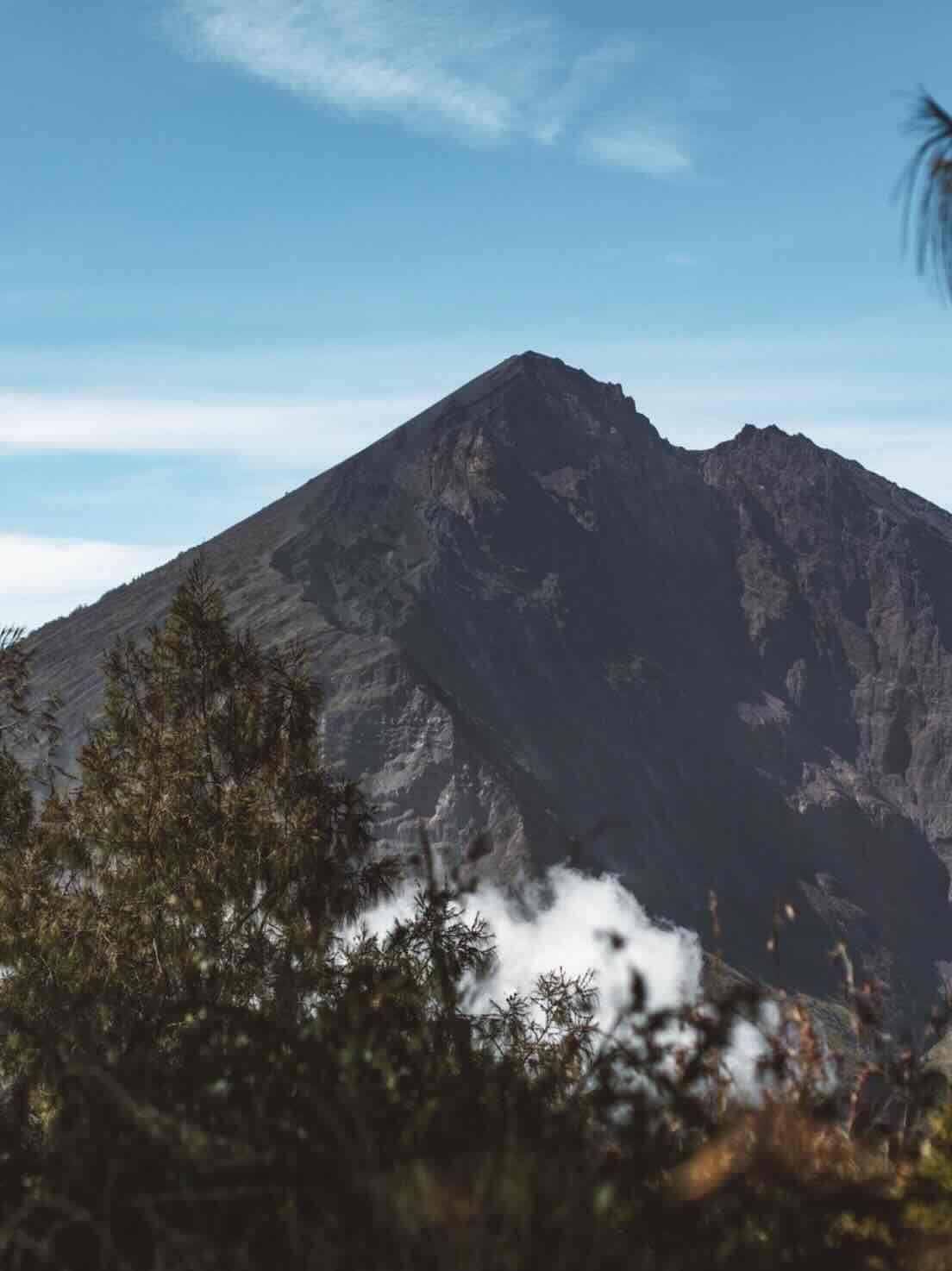 View of Mount Rinjani volcano peak during a multi-day trek in Lombok