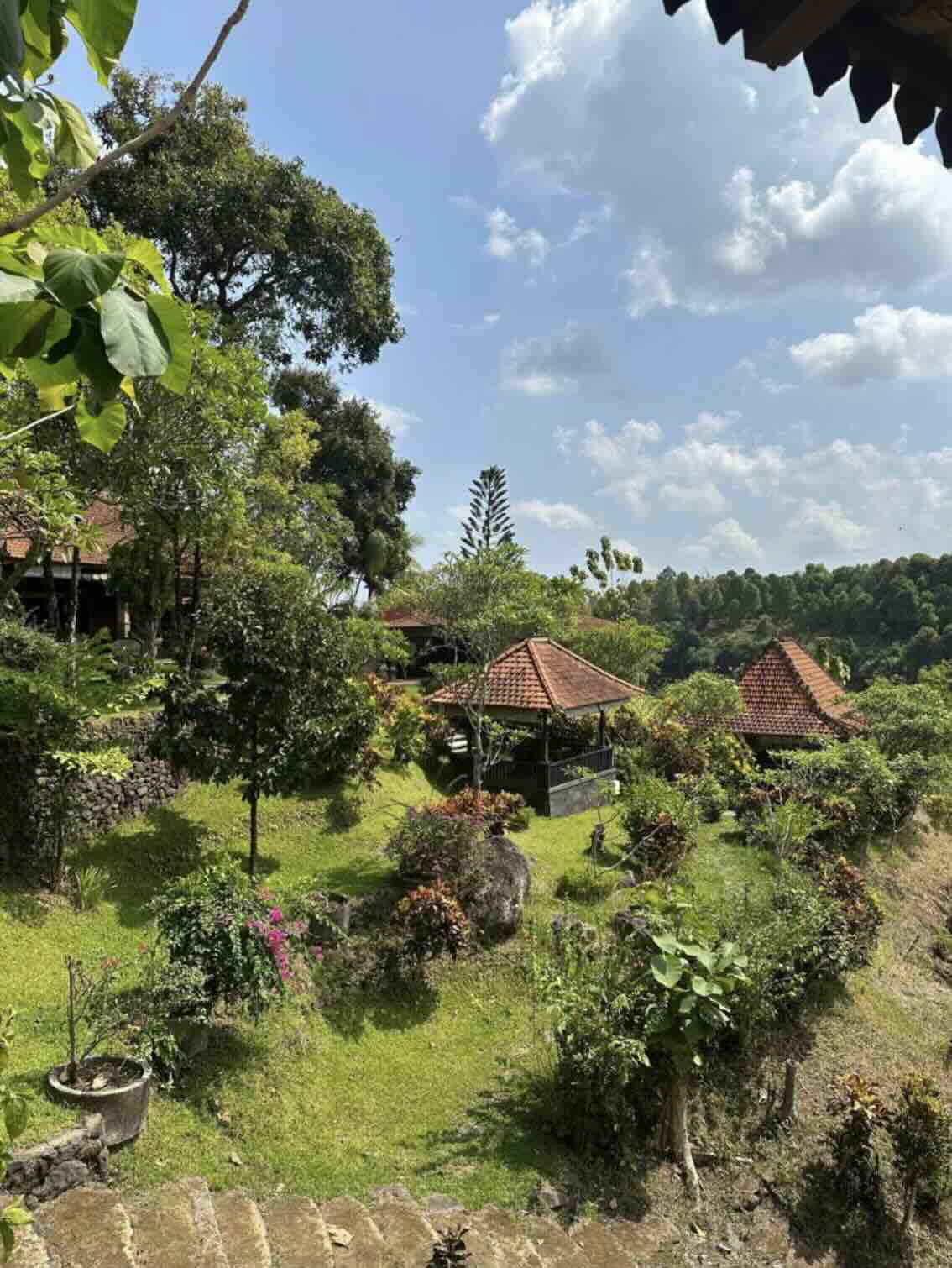 Lush mountain garden with small pavilions in Munduk, Bali