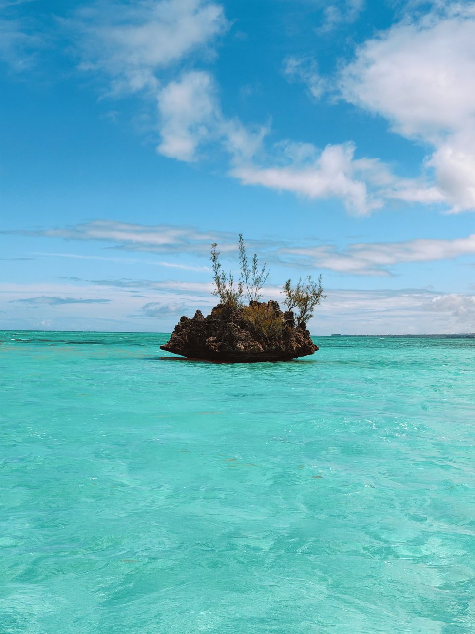 Crystal Rock rising from the turquoise lagoon near Île aux Bénitiers in Mauritius.