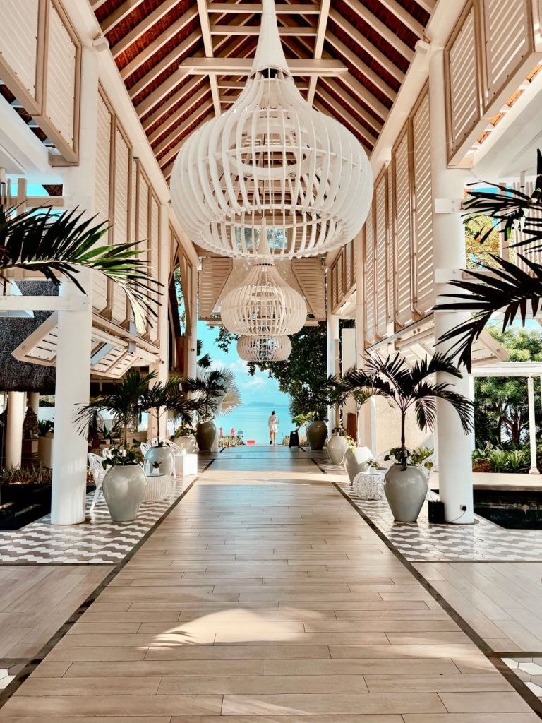 Open-air entrance and tropical interior at LUX* Grand Gaube in northern Mauritius.