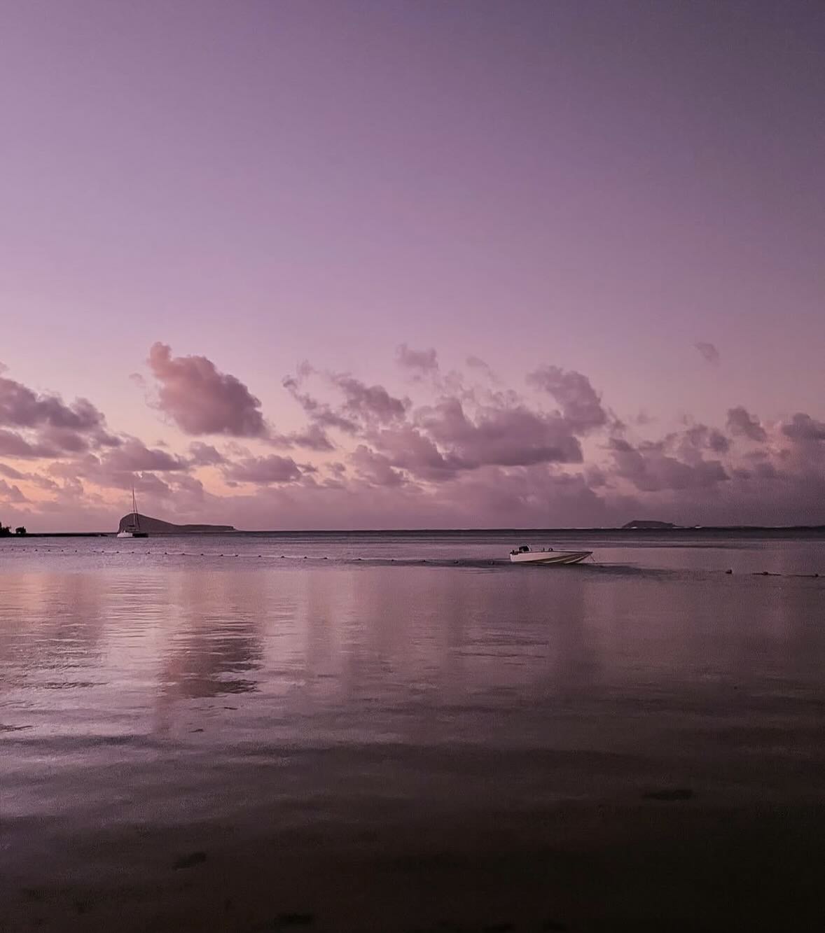 Purple sunset over the calm lagoon in Mauritius.