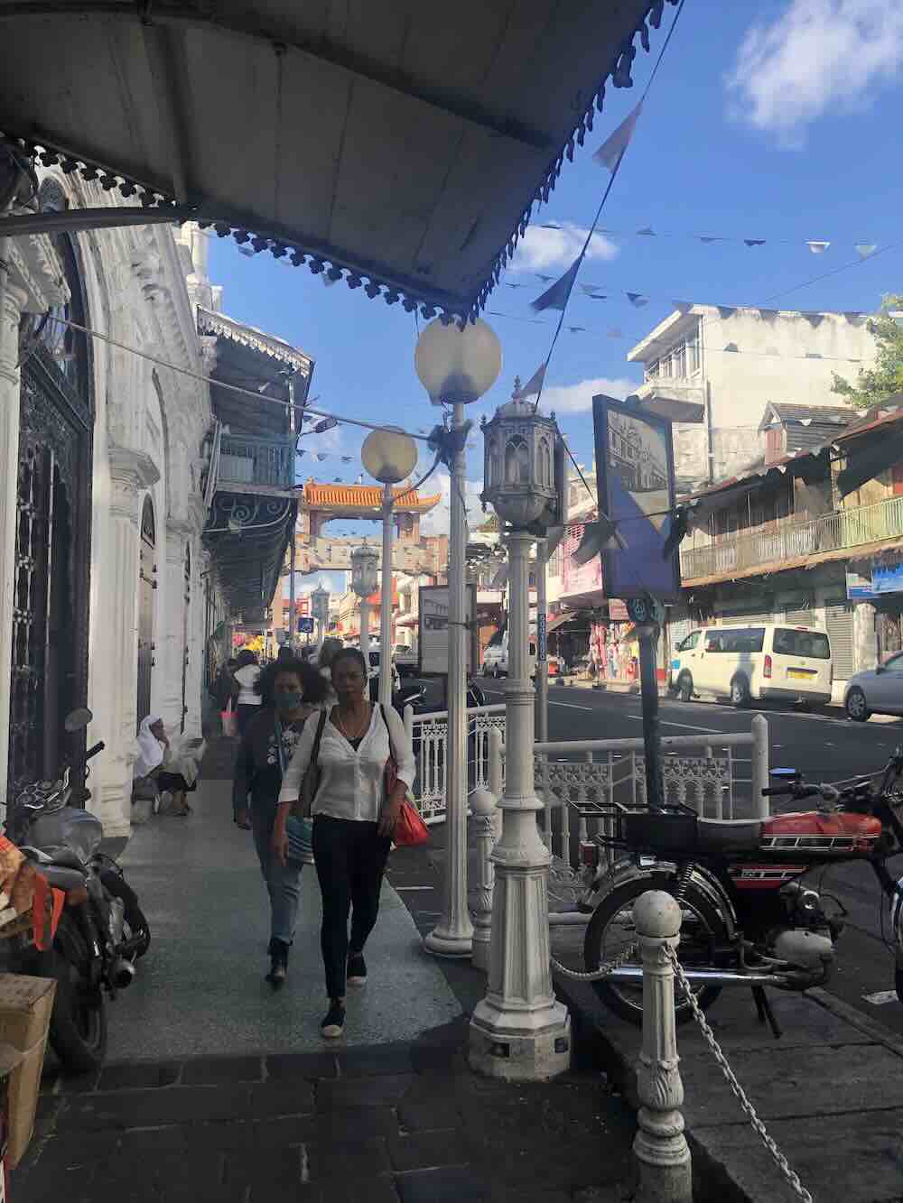 Historic street lined with colonial buildings in Port Louis, Mauritius.