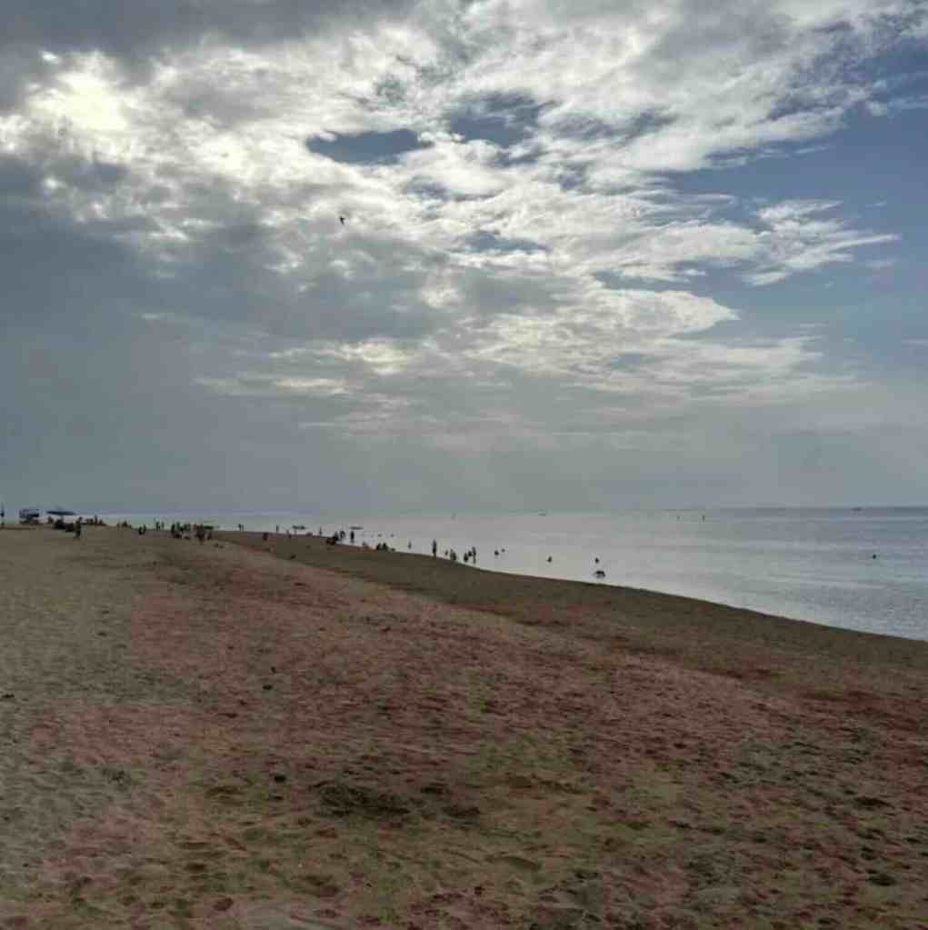 Quiet sandy beachfront path with ocean views along Sanur Beach in Bali