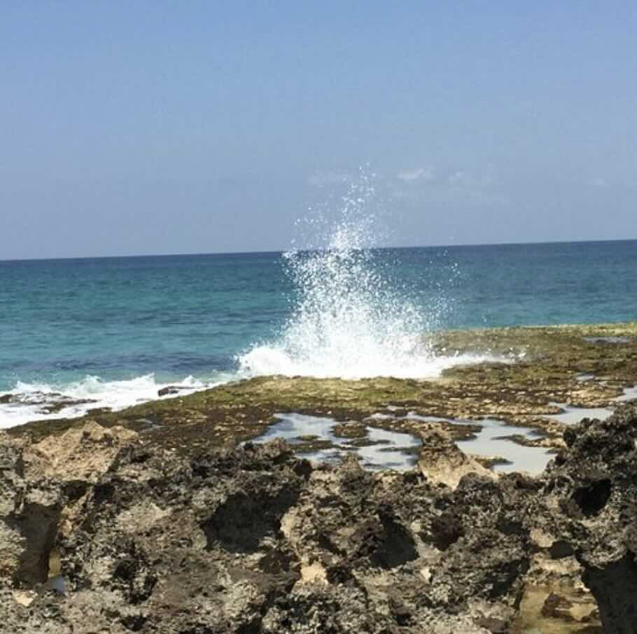 Pero Beach in West Sumba with rocky shoreline, ocean spray, and wild coastal scenery.