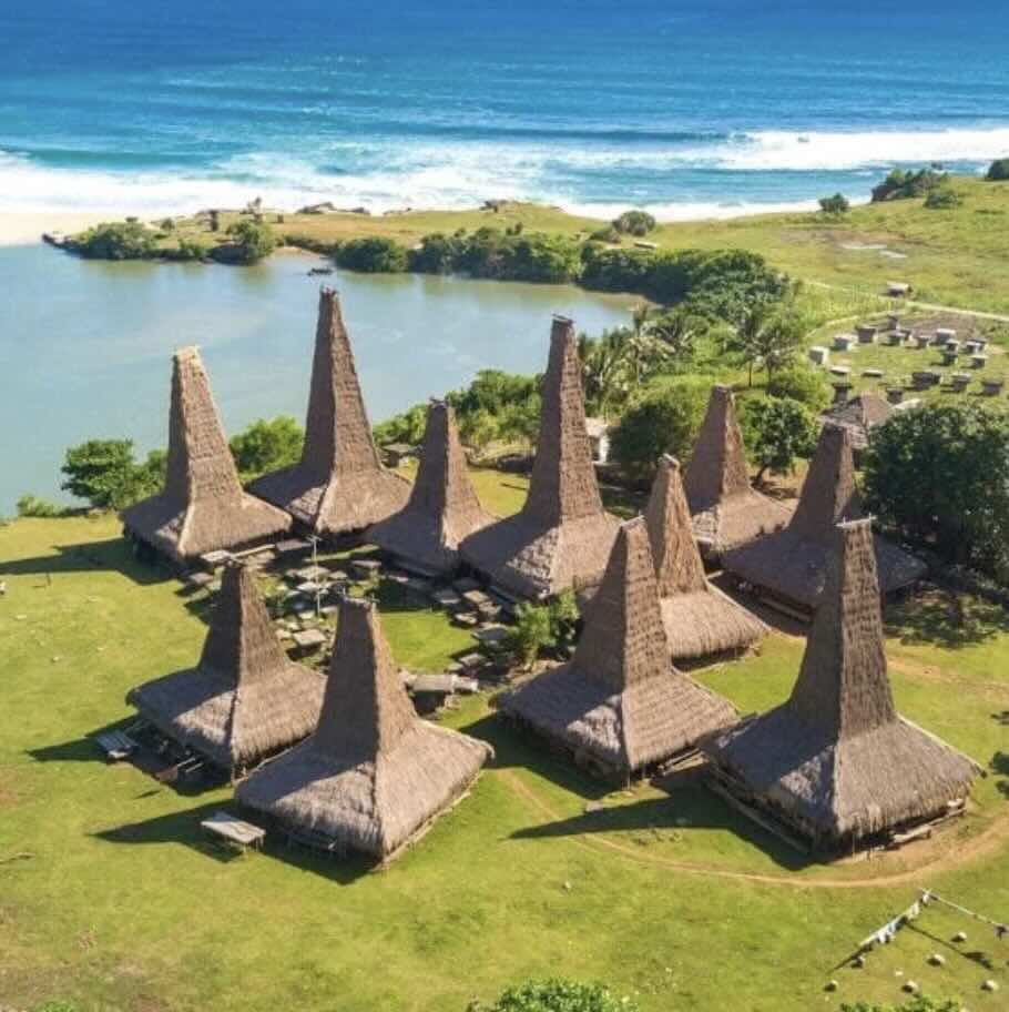 Ratenggaro Village in West Sumba with traditional tall thatched houses beside the coast.